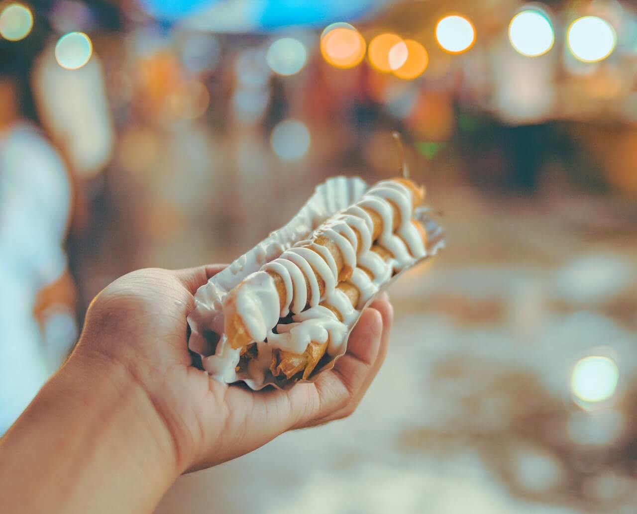 Person-Holding-Shanghai-Roll-Wraps-With-Mayonnaise